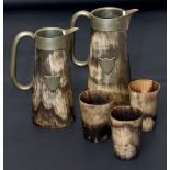 Two 19th century horn jugs, each with EPNS collar, spout, loop handle, shield cartouche and glass