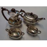 A 20th century silver plated four piece tea set. with hard wood handles and knops