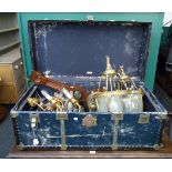 An early 20th century metal banded cabin trunk, containing a pair of gilt metal inverted bell form