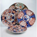 A late 19th/early 20th century Japanese Imari porcelain charger, decorated with reserves of