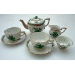 A Herend porcelain 'tea for two' decorated in green Chinese Bouquet