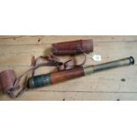 A World War I leather covered three-draw artillery spotting scope, with leather case, 28cm long