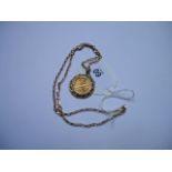 A half sovereign, in 9ct gold pendant mount, to a 9ct gold open link chain