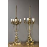 A pair of Louis XVI style gilt and damescened table lamps, each with tooled decoration and fitted