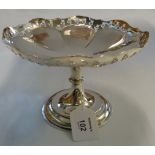 A tazza, shaped circular with pierced, panelled sides, to a flared knopped steam and spreading