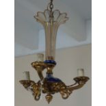 A gilt metal mounted, cased and cut glass Bohemian three branch electrolier, with scrolling arms,