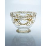 A 19th century French glass footed bowl, decorated in 'front of furnace' mustard enamel with