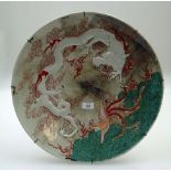 A late 19th century Japanese porcelain charger, of imposing proportions, decorated in shallow relief