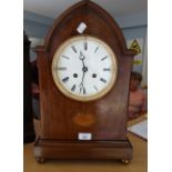 A late 19th century French two train mantel clock, with inlaid mahogany lancet arched form, the