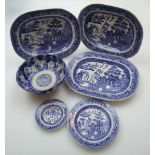 Three 19th century Staffordshire willow pattern meat dishes, 32 x 40cm, thirteen variously sized