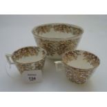 A 19th century English bone china part tea set, with bucket shaped cups and harp handles,