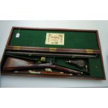 A 19th century mahogany cased single barrel side lock percussion sporting gun, with walnut fore