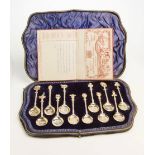 A cased set of twelve silver gilt commonwealth spoons, each cast and engraved with emblems from