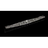 A Belle Epoque diamond set bar brooch, the graduated mixed old cut diamonds, millegrain mounted in