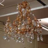 A George I design gilt metal and cut crystal hanging chandelier, with twelve sconces