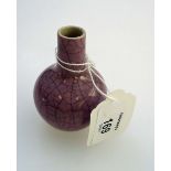 A Chinese Sung style porcelain miniature crackle glass bottle vase, with light plum ground,