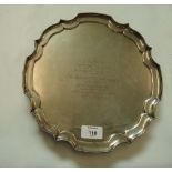 James Dixon and Son, a silver presentation salver, with pie crust rim on four scroll cast feet,