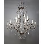 A large and impressive Bohemian bronze and cut glass hanging chandelier, with swags of drops and
