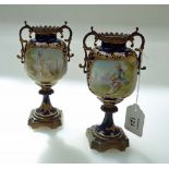 A pair of 19th century Sevres bleu de Roi porcelain, gilded and ormolu mounted twin handled pedestal