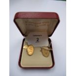 A pair of Egyptian 12ct gold cufflinks, of traditional oval form with bright cutting, bearing the