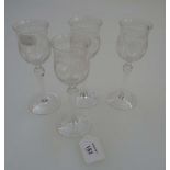 A part suite of nine Edwardian liqueur glasses, each having baluster bowl etched with a reserve of a