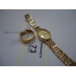 A lady's 9ct gold Accurist wristwatch, the oval cream dial with baton numerals and single diamond at