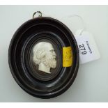 A 19th century carved ivory profile bust study of Plato?, in a moulded oval ebonised frame, 10cm