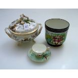 A late 19th century French pottery armorial tureen and cover, a Paris porcelain jardiniere, a