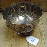 A Victorian silver petal edged small pedestal bowl, with floral embossing, bearing the legend