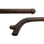 A Fijian hardwood Kiakavo, typically spurred with a medial ridge and roughly carved underside and