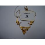 A French Art Nouveau foliate necklace, the three floral central panels with baroque pearl drops, the