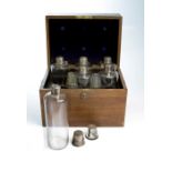 The Phillips Liqueur case, the oak case with brass lock and furniture,opening to reveal six silver