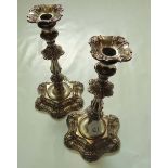 A pair of mid 18th century style silver plate on copper table candlesticks, each with knopped column