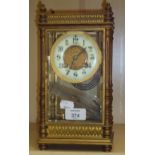 A 19th century French gilt metal four glass mantel clock, the four pillar case with knop finials,
