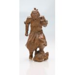 A late 19th century Japanese carved boxwood okimono, the heavenly King Bishamonten (God of