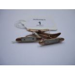 A pair of 9ct rose gold cuff links, in the form of mother of pearl handled pen knives, 6gms