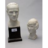 A mid 20th century carved marble bust of a gentleman, together with another of a lady, on ebonised