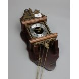 A reproduction Dutch Zaandam-type clock, the architectural shaped and waisted mahogany case with