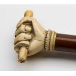 A 19th century marine ivory whaler's or 'friendship fist' cane, with tapering malacca shaft, 89cm