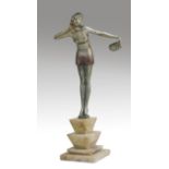 An Art Deo period patinated spelter figure of a dancing girl holding fan, on a stepped chamfered