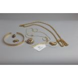 A 9ct gold bangle, (cut) on open link chain, a pair of 9ct gold cufflinks and a brooch