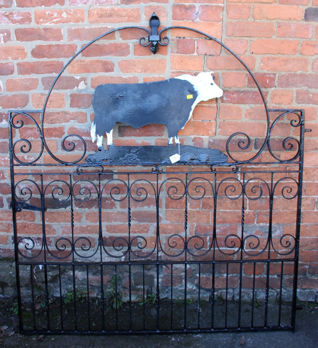 A wrought iron gate, with cut steel bull silhouette, 154 x 137cm