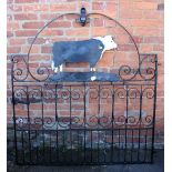 A wrought iron gate, with cut steel bull silhouette, 154 x 137cm