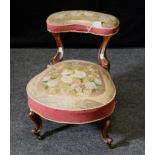 A Victorian walnut child's prie dieu, with gros point tapestry upholstery