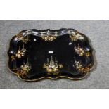 A Victorian papier mache black lacquer painted and florally mother of pearl decorated tray of