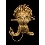 A 9ct gold stylised lion brooch, with circular cut sapphire eyes and a mop-style mane