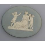 A Turners of Lane End light blue oval Jasper panel with a classical scene of nymphs and Psyche,