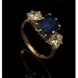 A sapphire and diamond three stone half hoop ring, the central step-cut sapphire flanked by