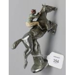 A chrome plated and cold painted brass car mascot, fashioned a racehorse withy jockey up, 13 x 13cm