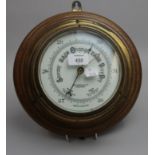 John Barker and Co. Ltd, Kensington, an early 20th century brass cased aneroid barometer, mounted on